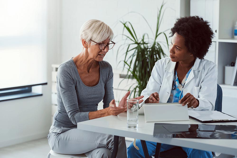 female patient and doctor talking